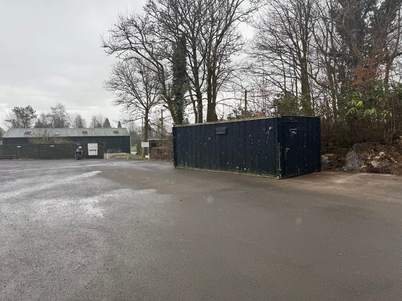 The container in position near the clubhouse area